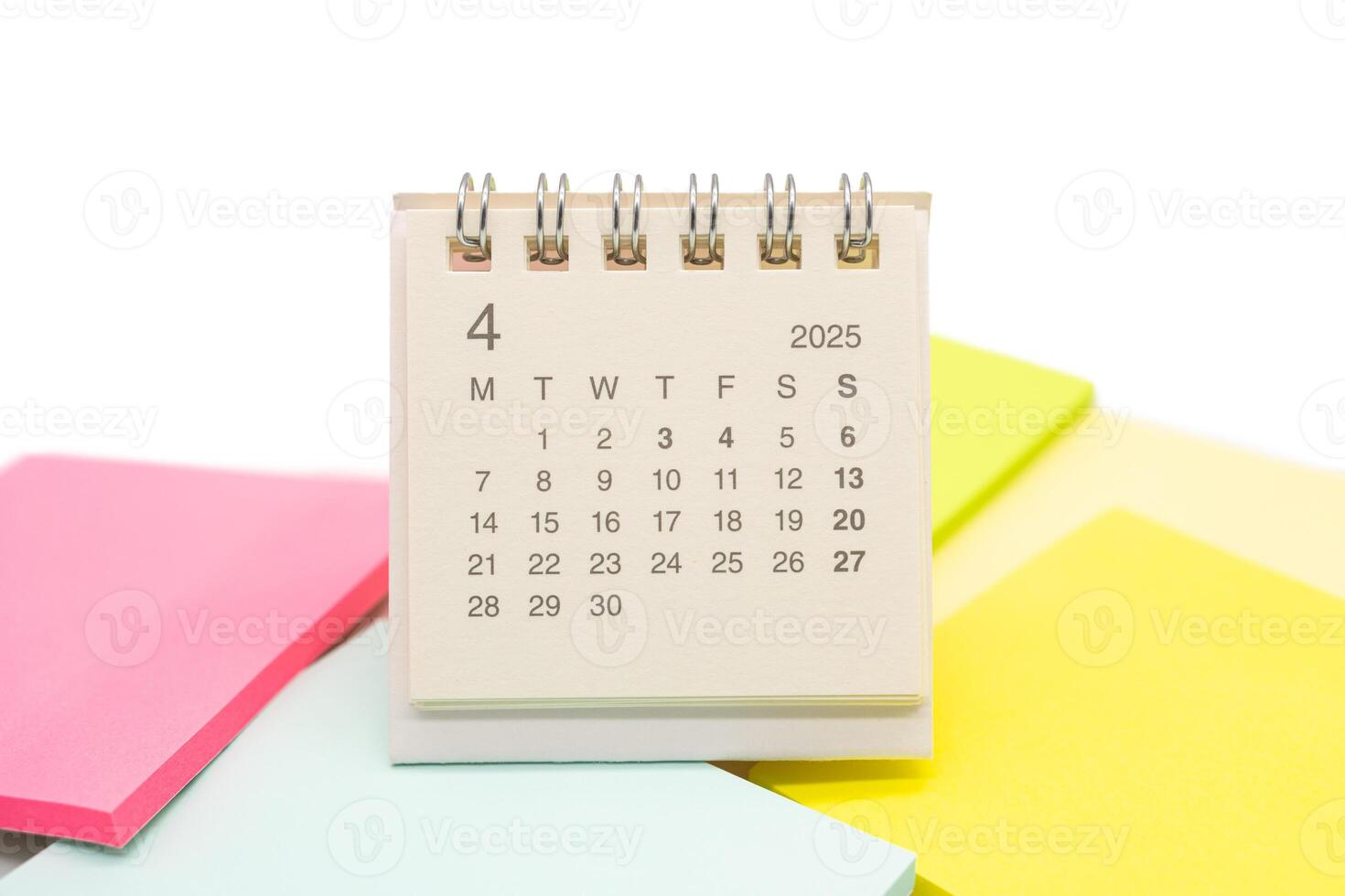 Mini Desk Calendar for APRIL 2025 background. Calendar concept with 2025 APR calendar. Sticky note. isolated on white background. photo