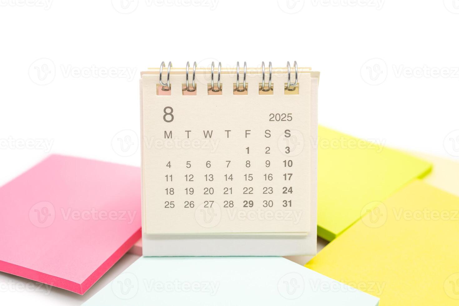 Mini Desk Calendar for AUGUST 2025 background. Calendar concept with 2025 AUG calendar. Sticky note. isolated on white background. photo