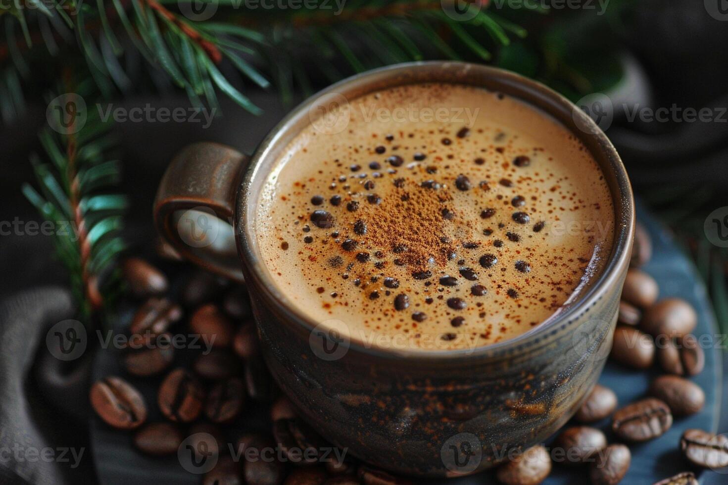 A rustic cup of freshly brewed coffee with frothy crema, sprinkled with cinnamon, surrounded by roasted coffee beans and pine branches. photo