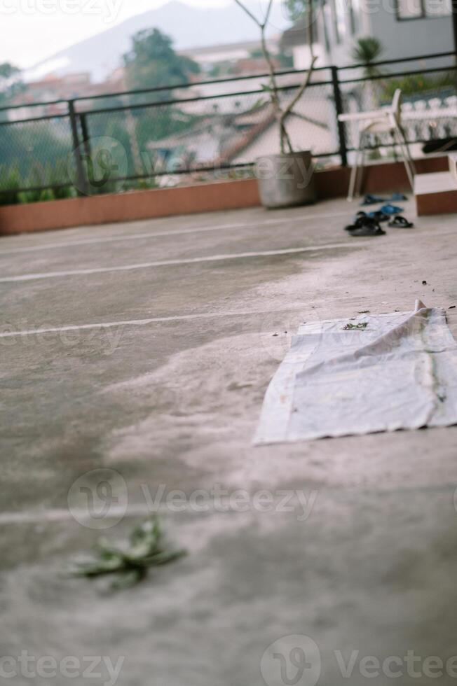 Concrete rooftop scene with mountain backdrop on a quiet, calm morning photo