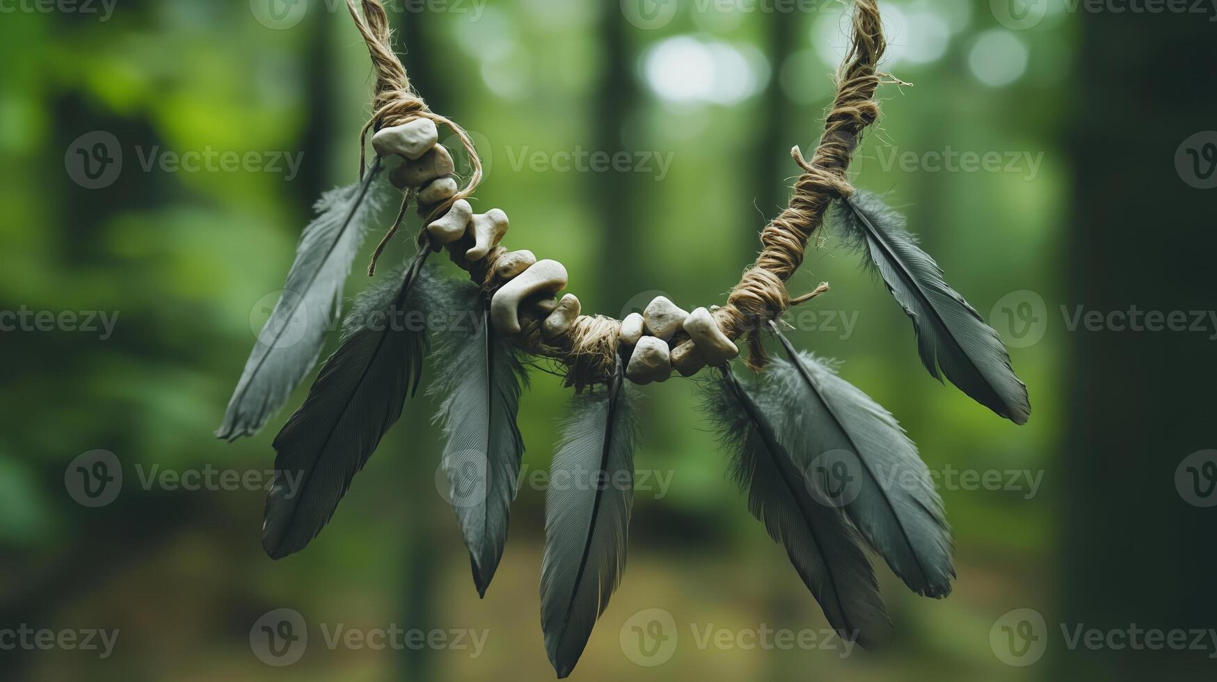 The necklace with weathered bones and dull gray feathers against a forest background. 9 photo