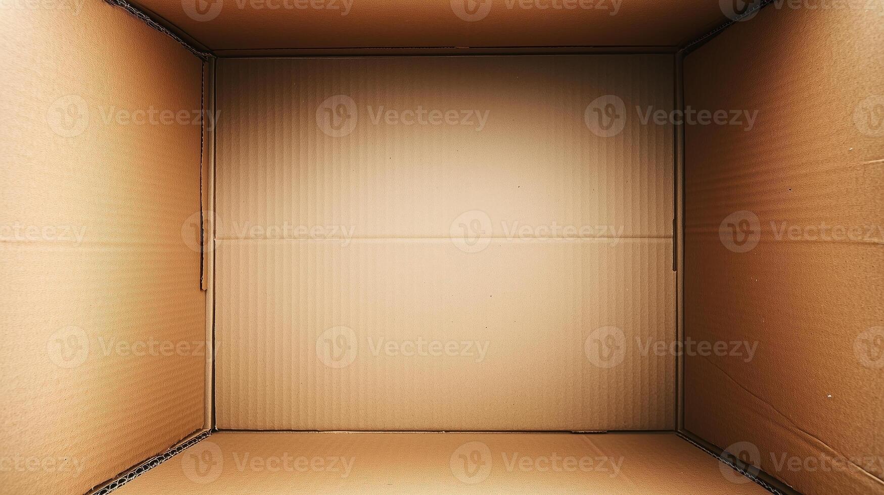 An open cardboard box with vertical deep walls viewed from the top. 15 photo