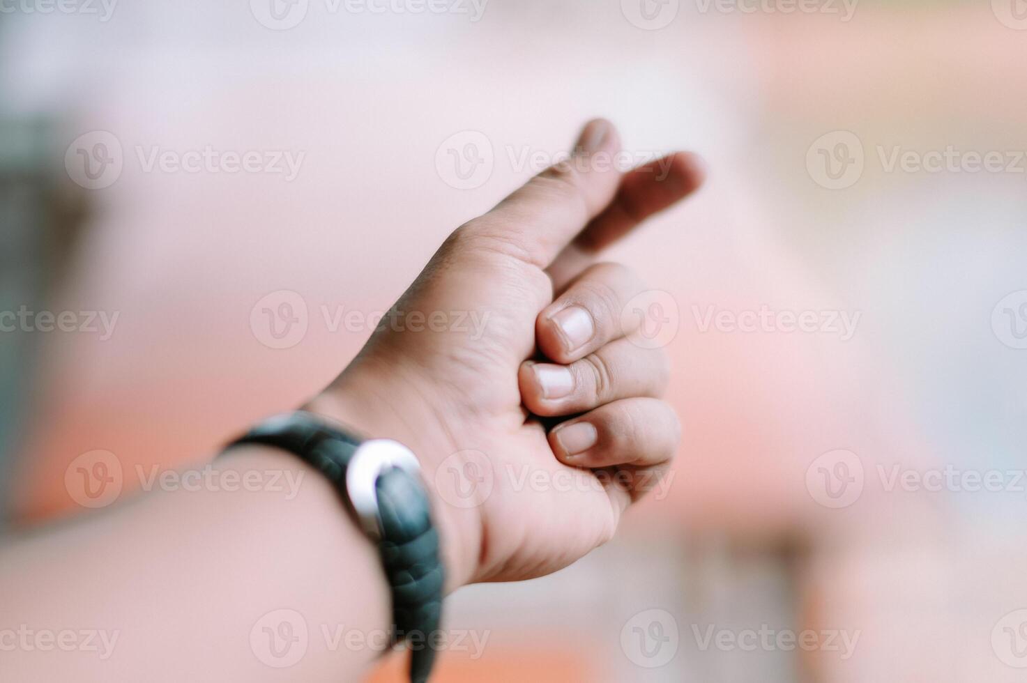 Mini heart gesture from a person with wrist watch symbolizing affection photo