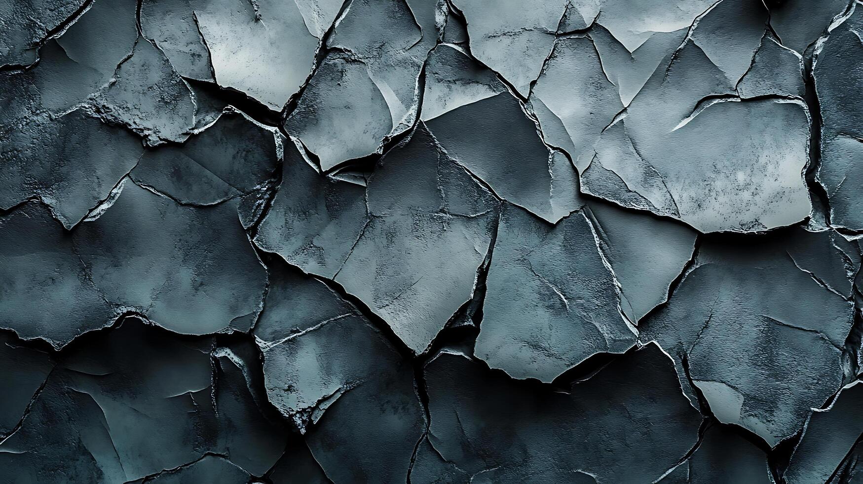 Monochromatic stone fragments form an abstract rock texture with rugged edges and varied gray tones, creating a visually striking composition. photo
