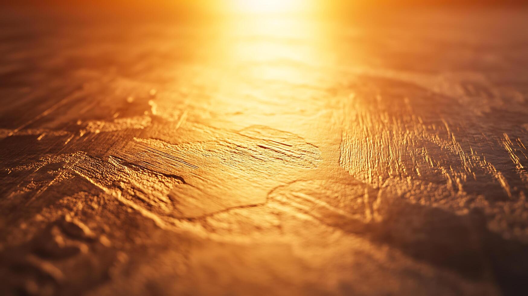 Golden Textured Surface Abstract background with a rough, textured surface in warm golden tones, illuminated by a bright light source. photo