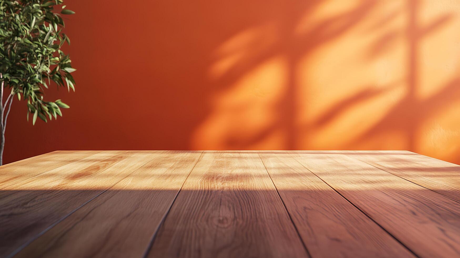 A minimalist indoor setting featuring a wooden table against a vibrant orange wall with plant shadows, creating a warm and inviting atmosphere. photo