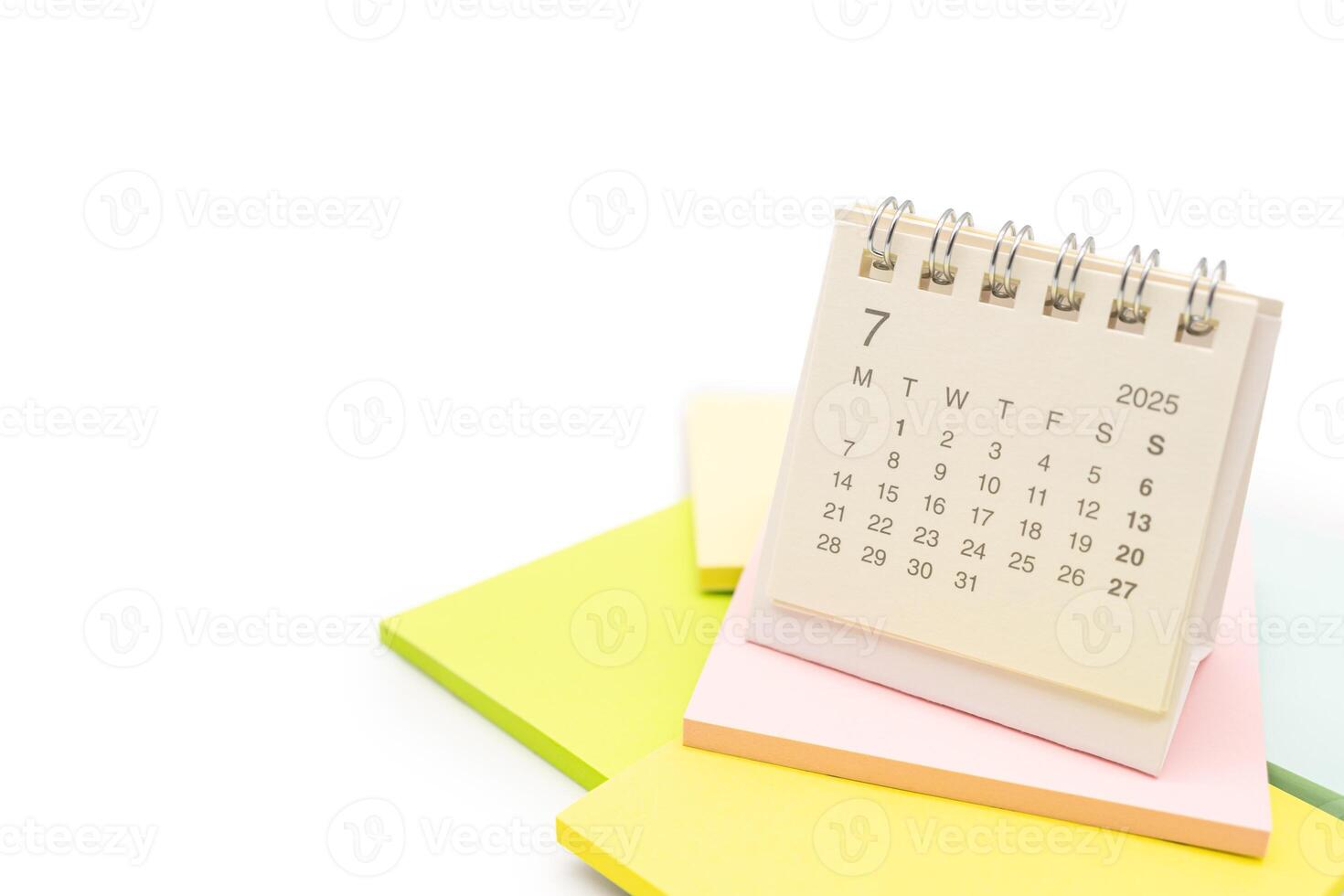 Desk Calendar for JULY 2025 background. Calendar concept with 2025 JUL calendar on Sticky note. isolated on white background. photo