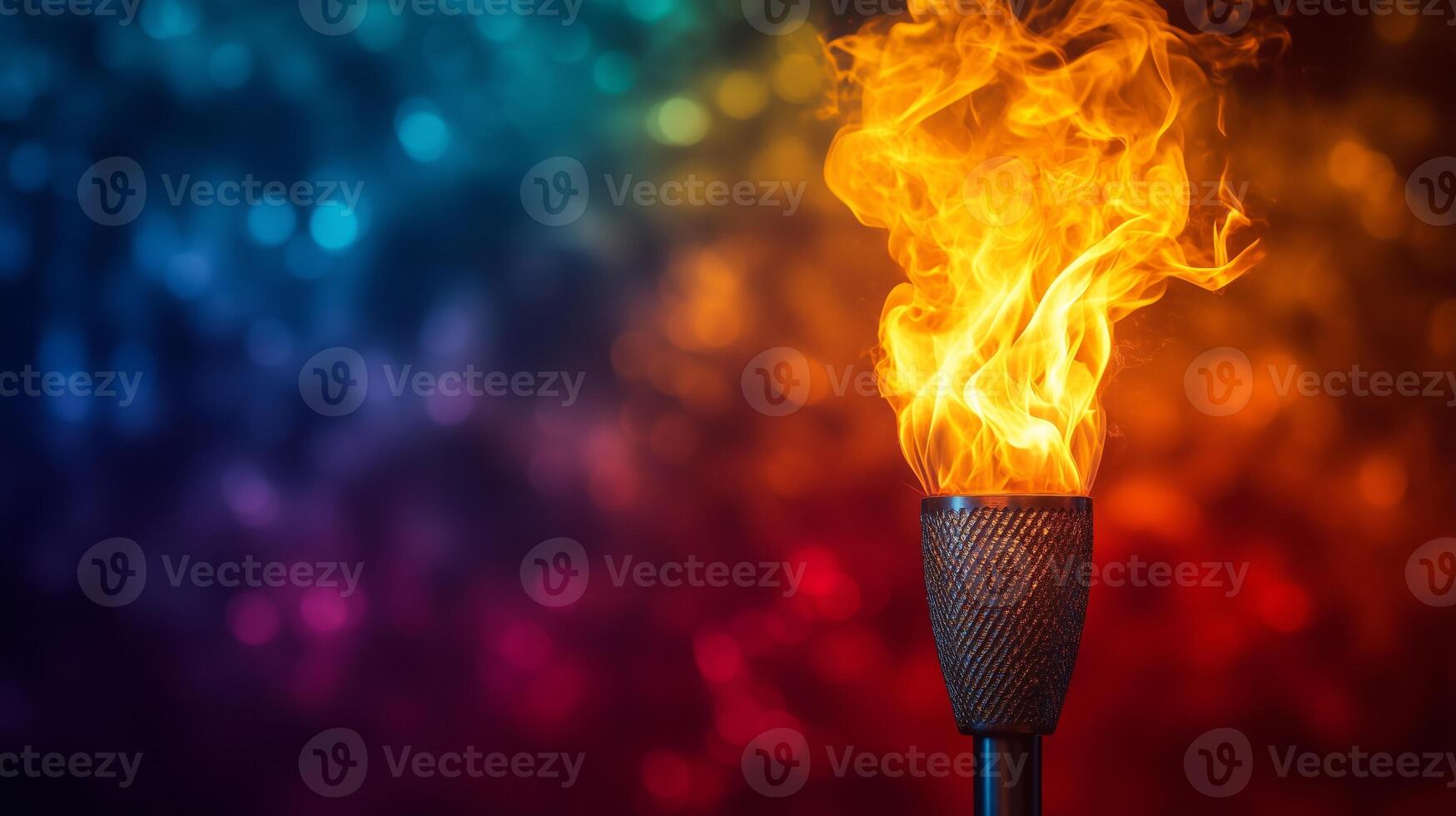 A flame is lit on a olympic torch photo