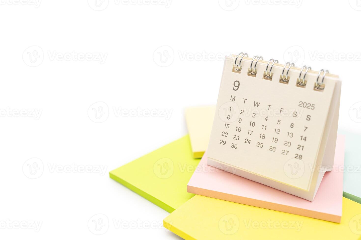 Desk Calendar for SEPTEMBER 2025 background. Calendar concept with 2025 SEP calendar on Sticky note. isolated on white background. photo