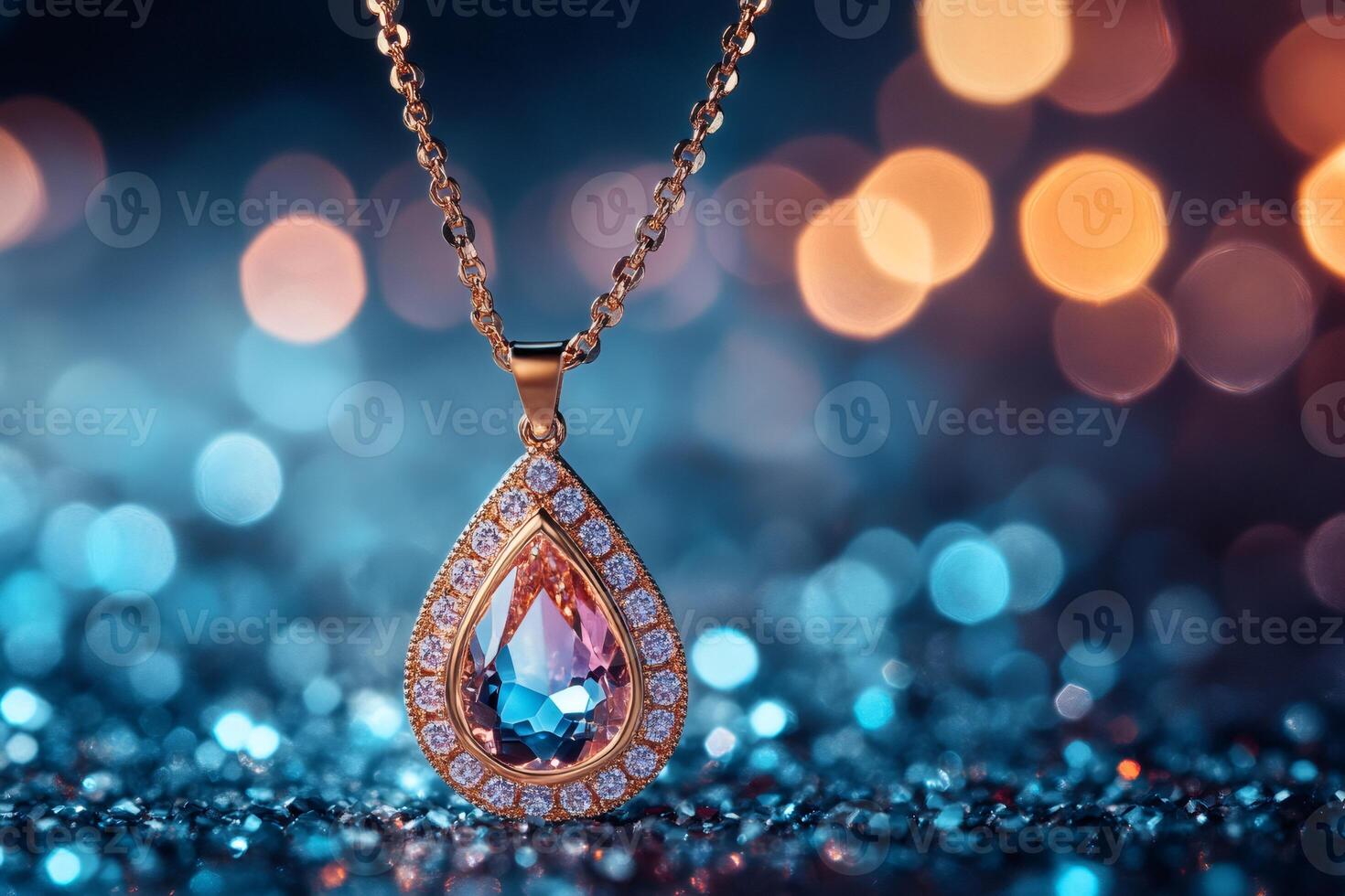 Golden necklace with sparkling gemstone pendant on glittering background photo