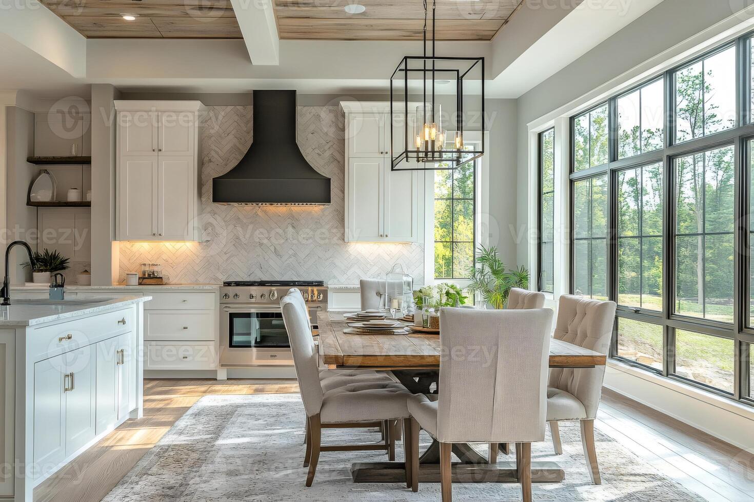 Modern farmhouse kitchen and dining room with large windows showing greenery photo