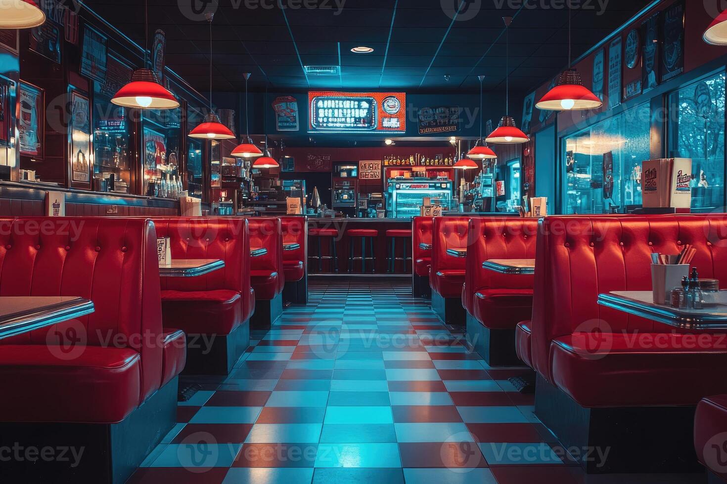 Empty american diner booths and counter seating with red leather and checkered floor photo