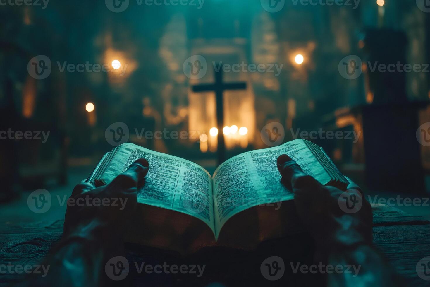 Priest reading holy bible in church under cross light photo