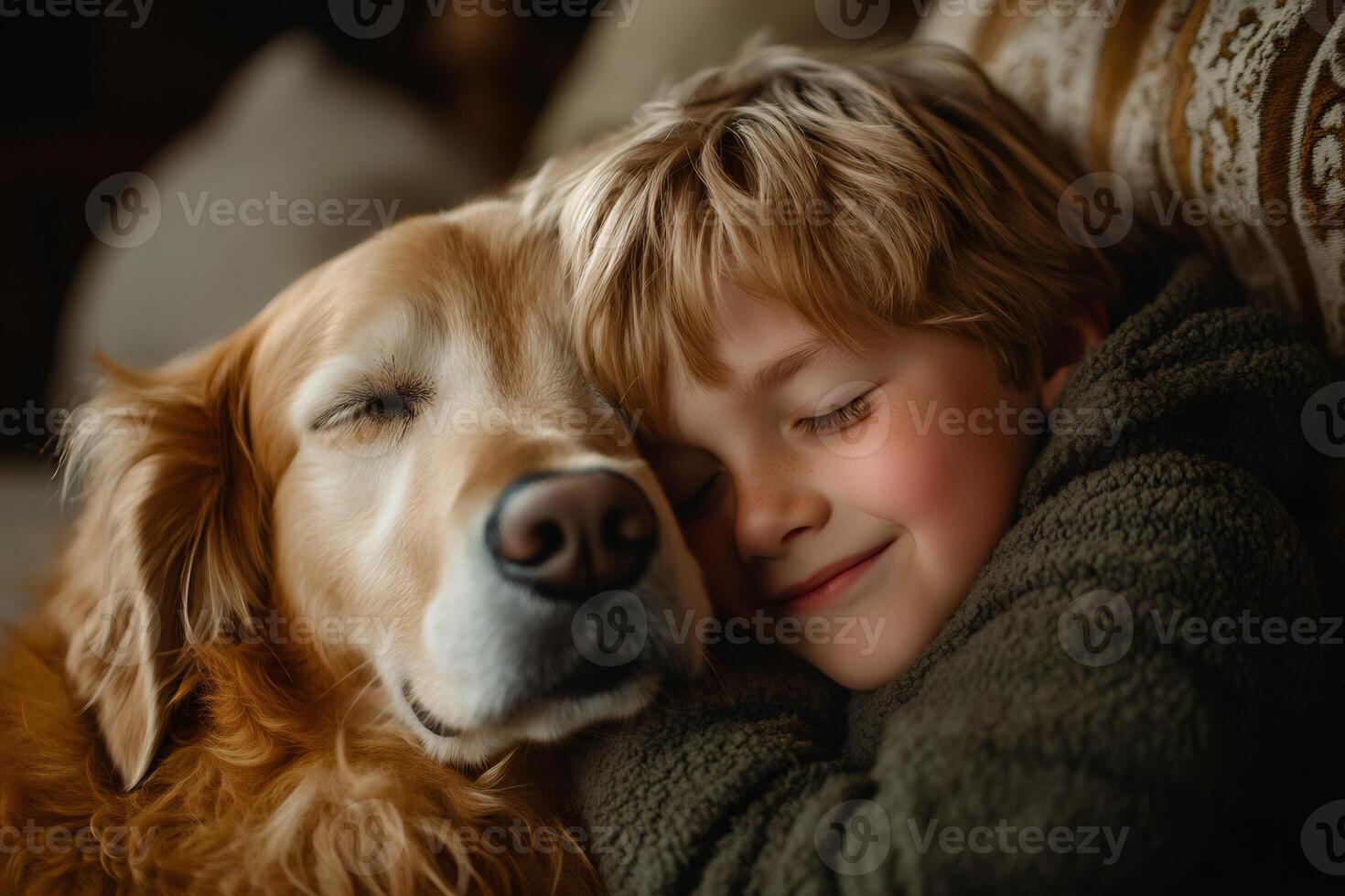 Child sleeping and hugging golden retriever dog on sofa photo