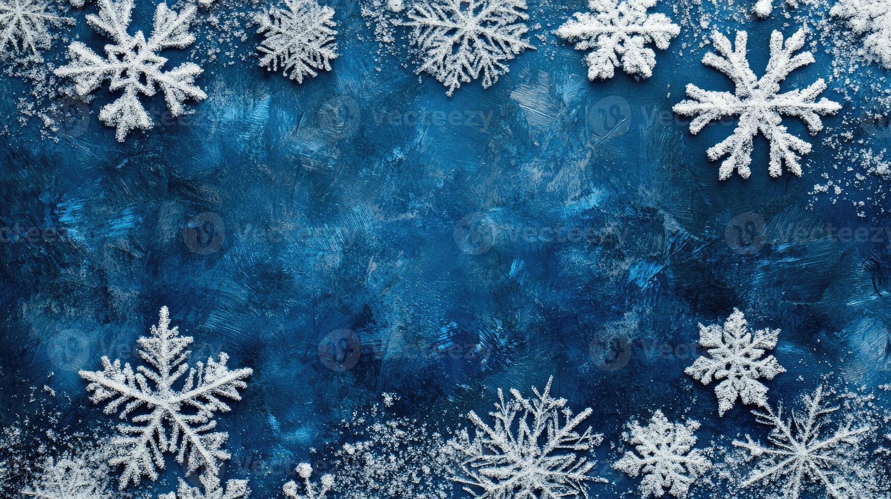 Christmas background with snowflakes forming a frame on blue surface photo