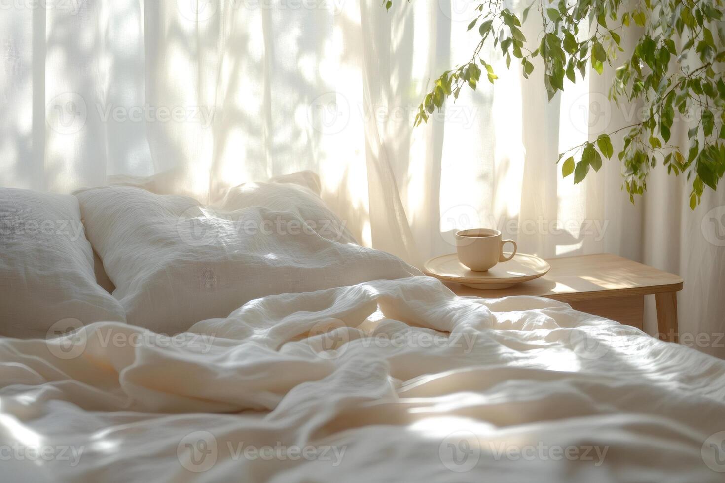 Cozy morning sunlight illuminating unmade bed with coffee cup on nightstand photo