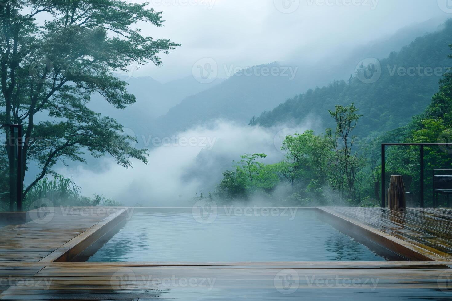 Infinity pool overlooking misty mountains in a luxury resort photo