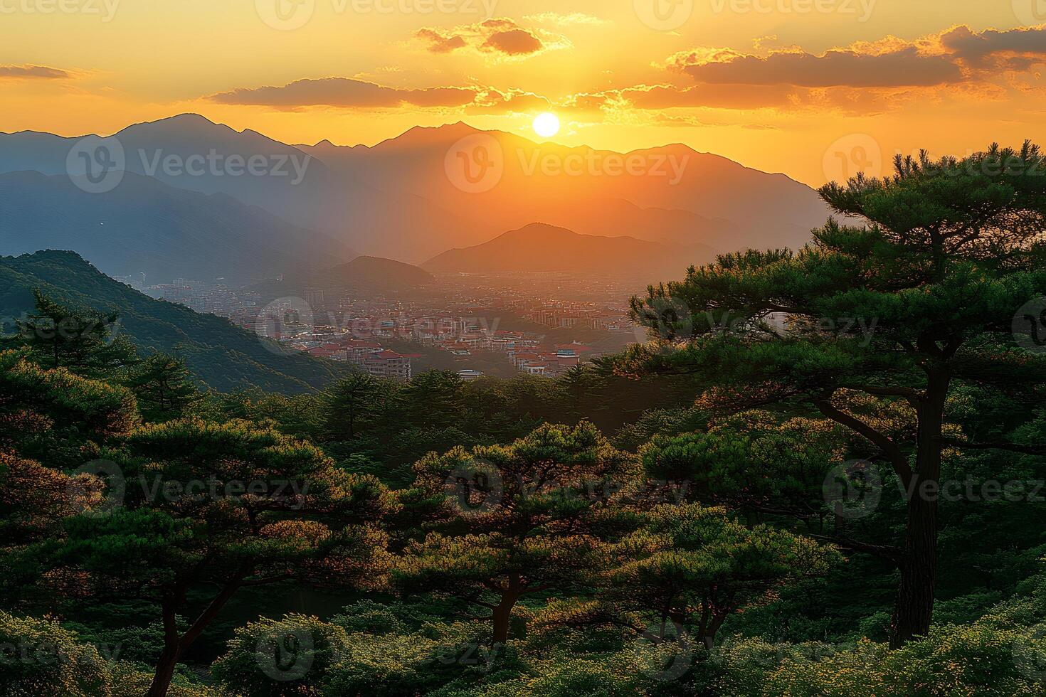 Serene Sunset Over Mountain Landscape with Lush Foliage and Cityscape photo