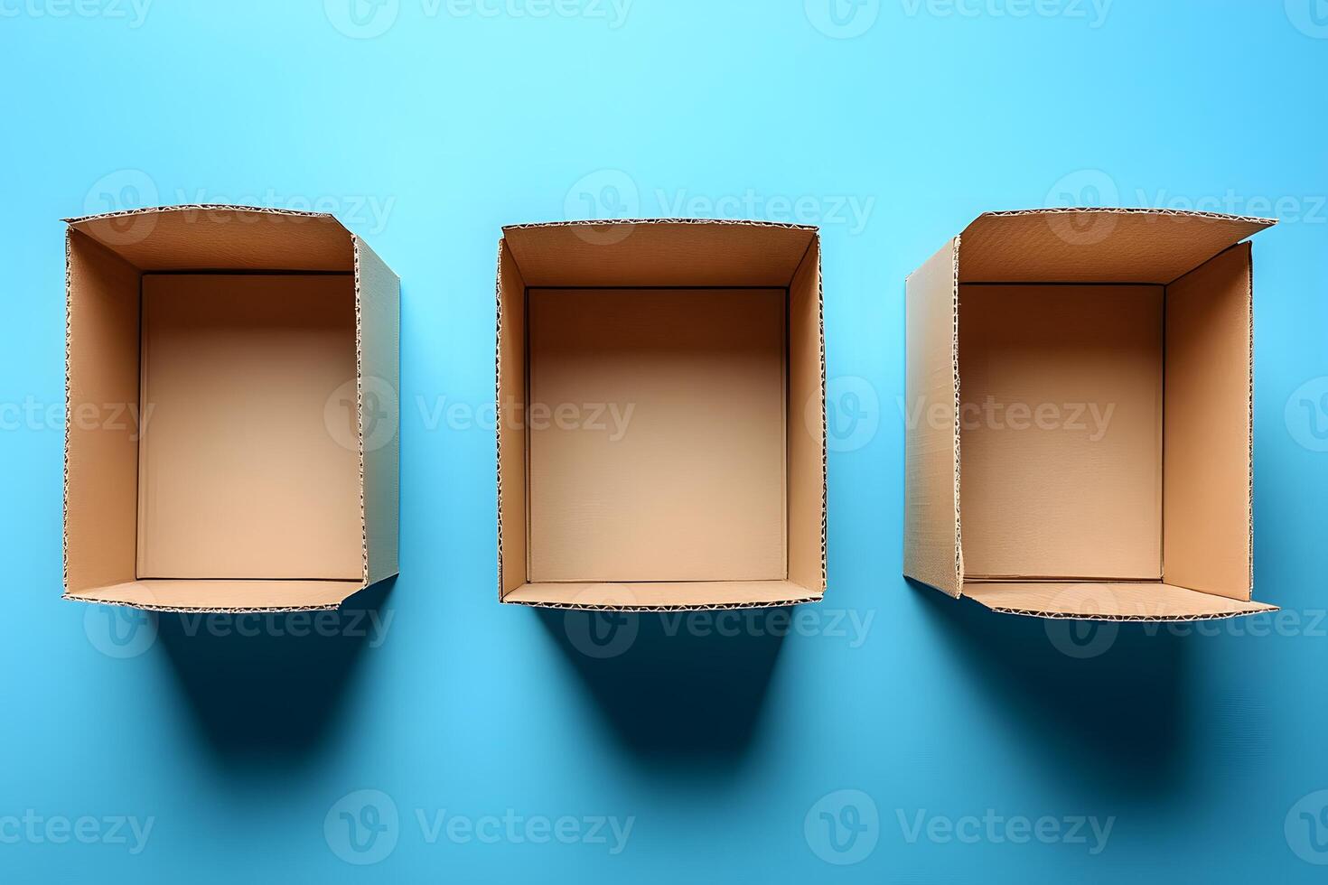 Three Cardboard Boxes on Blue Background for Organization and Shipping Themes photo