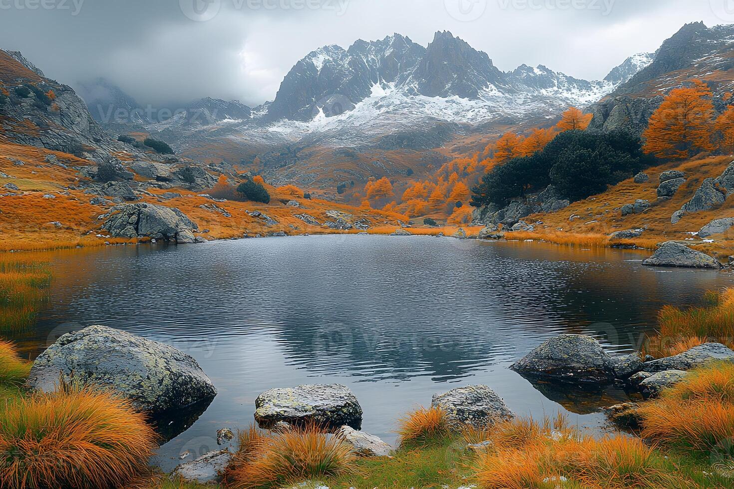 Autumn Tranquility Amidst Dramatic Mountain Peaks and Serene Lake photo