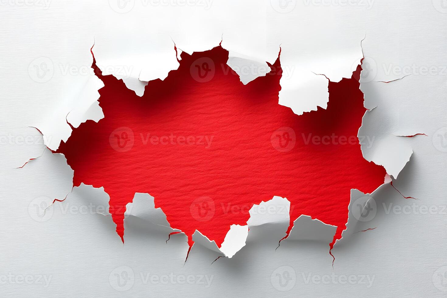 Red Background Revealed Through Torn White Paper for Creative Design Concepts photo