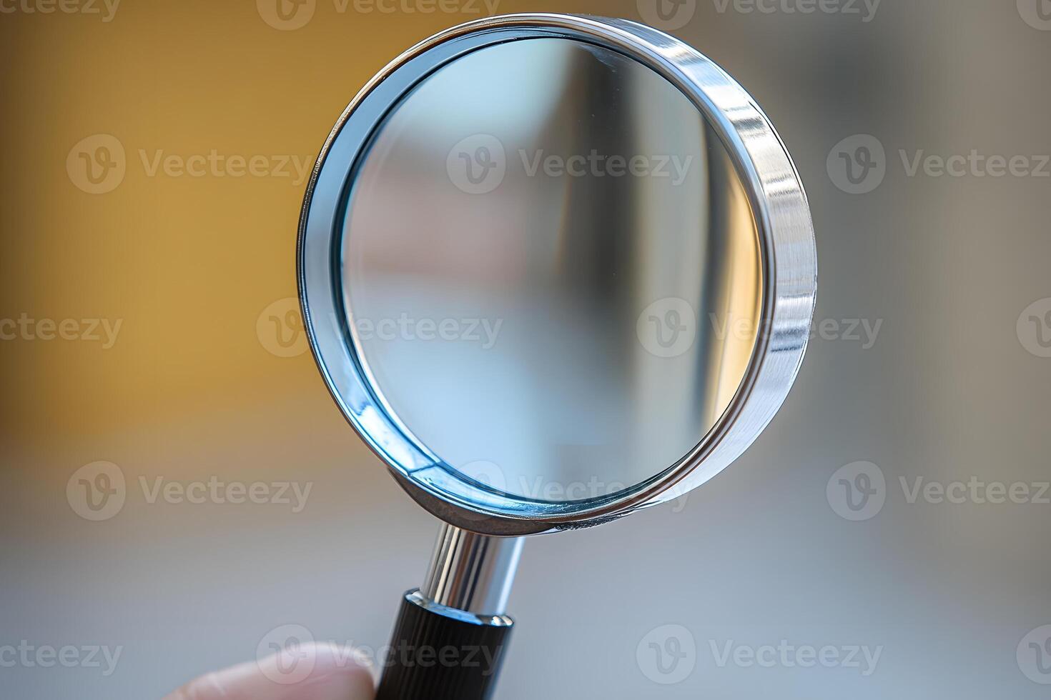 Close-Up View of Magnifying Glass Against Soft Focus Background photo