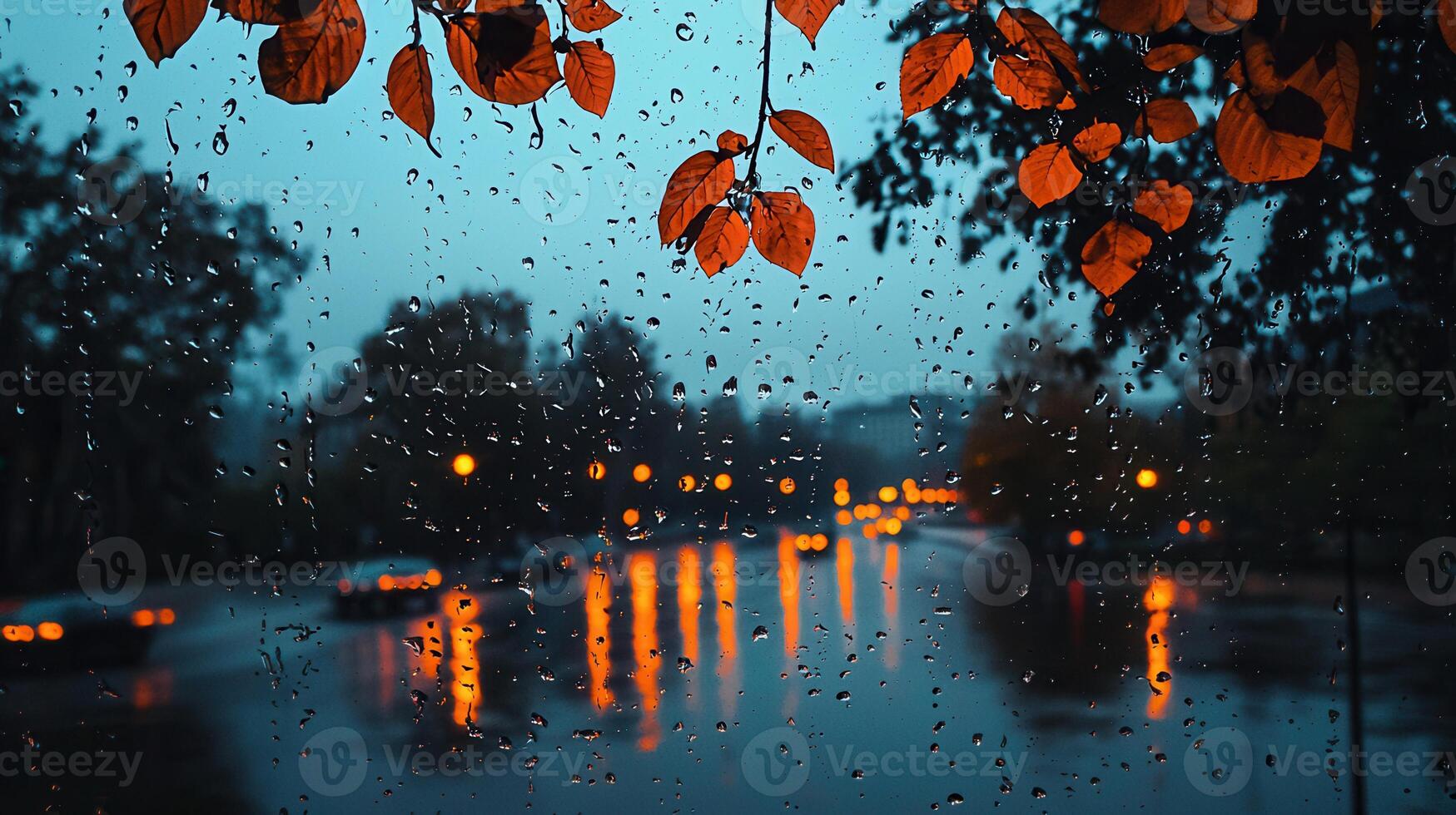 Rainy Autumn Evening Cityscape Viewed Through a Window with Red Leaves photo