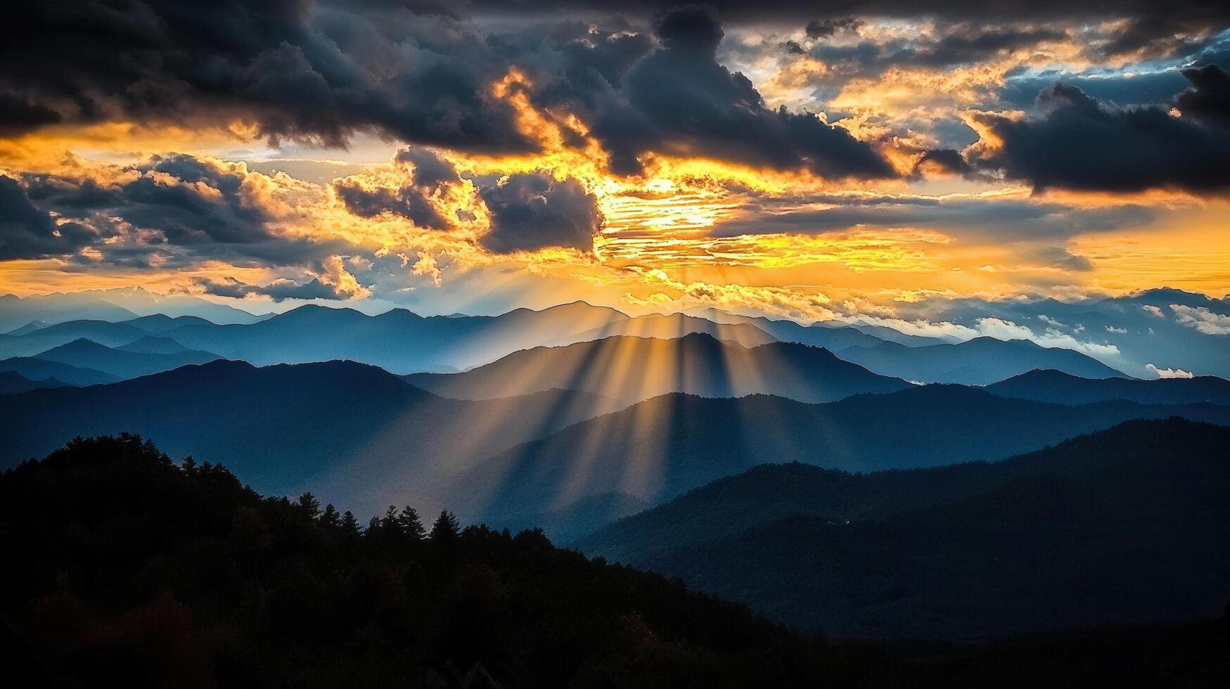 Majestic Sunset Rays Illuminating Layers of Blue Mountains Dramatic Sky Golden Hour Landscape photo