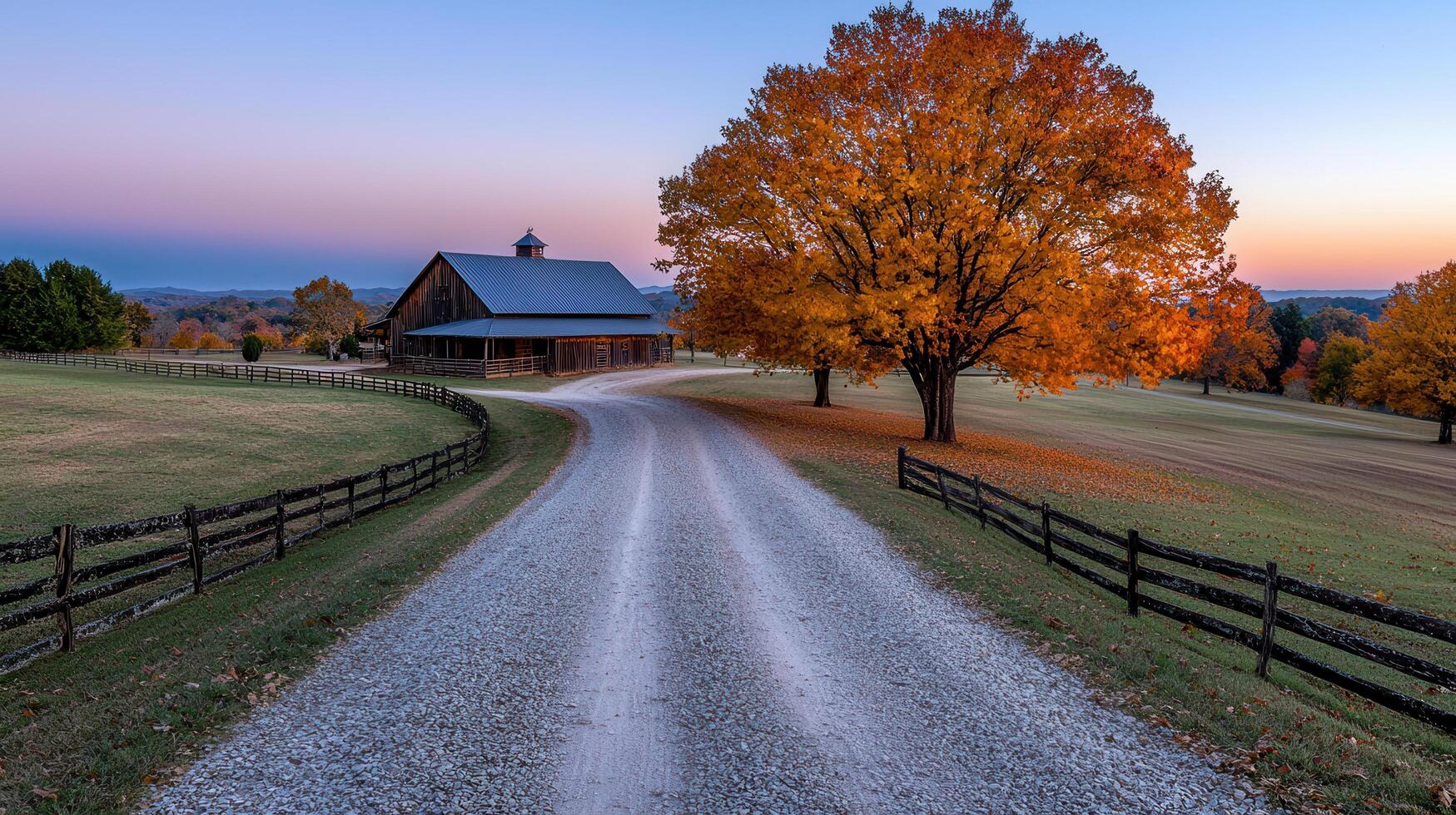 Scenic Autumn Countryside Gravel Road Leading to Rustic Barn and Vibrant Fall Foliage photo