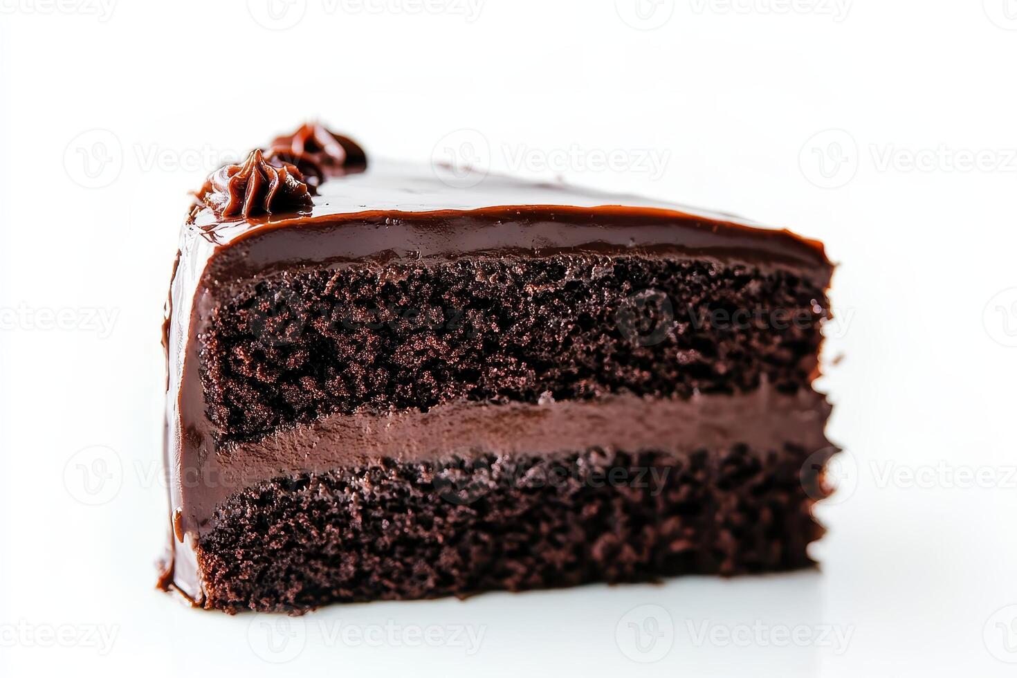 A slice of rich chocolate cake with a glossy chocolate frosting. photo