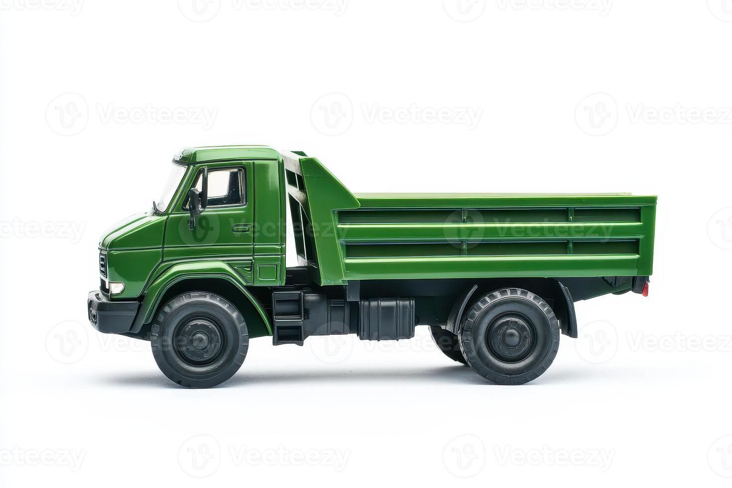 A green dump truck viewed from the side, showcasing its utility and design. photo