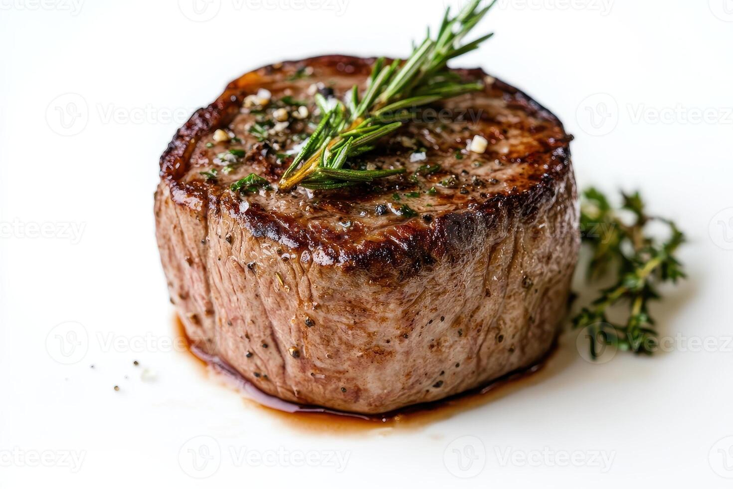 A beautifully cooked beef steak garnished with herbs, showcasing culinary presentation photo
