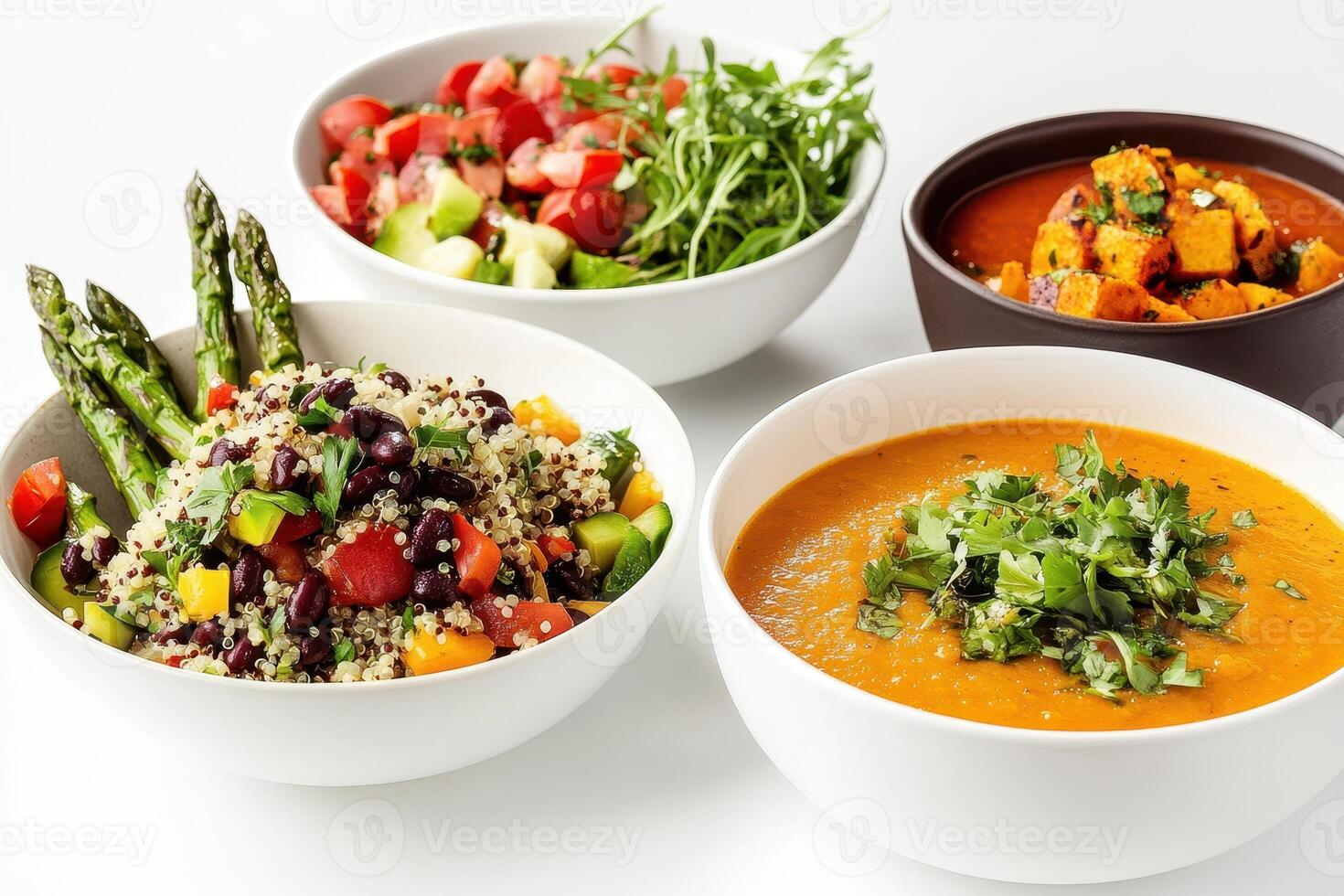 A colorful array of healthy dishes including salads, soups, and grains photo
