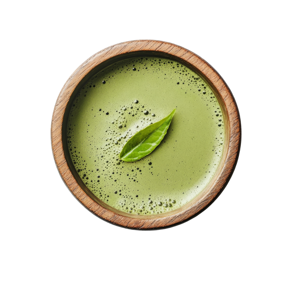 Freshly prepared instant matcha green tea in a wooden bowl with a leaf garnishing the top, instant matcha green tea in wood bowl with leaf on transparent background png