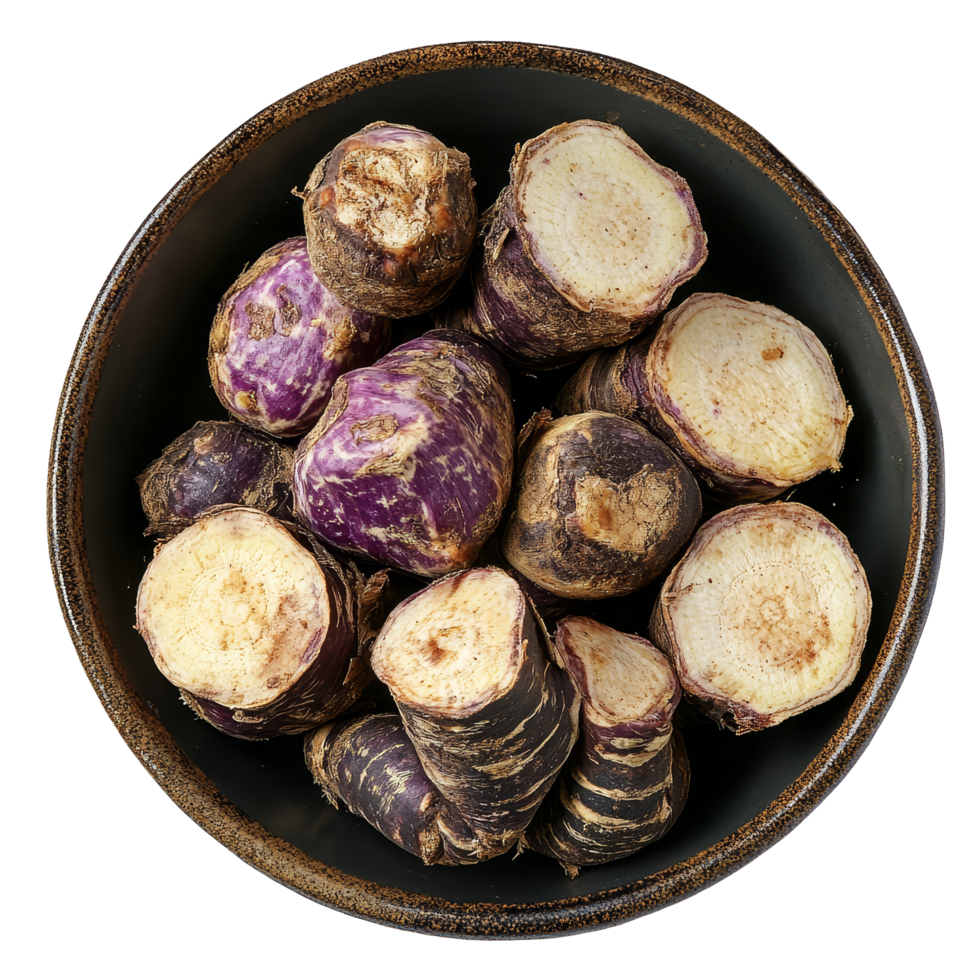 Fresh taro root cut into pieces displayed in a rustic plate on a simple transparent background, taro root in plate on transparent background png