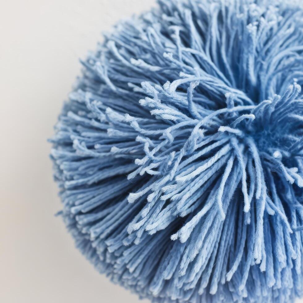 Close up blue pom pom with white background photo