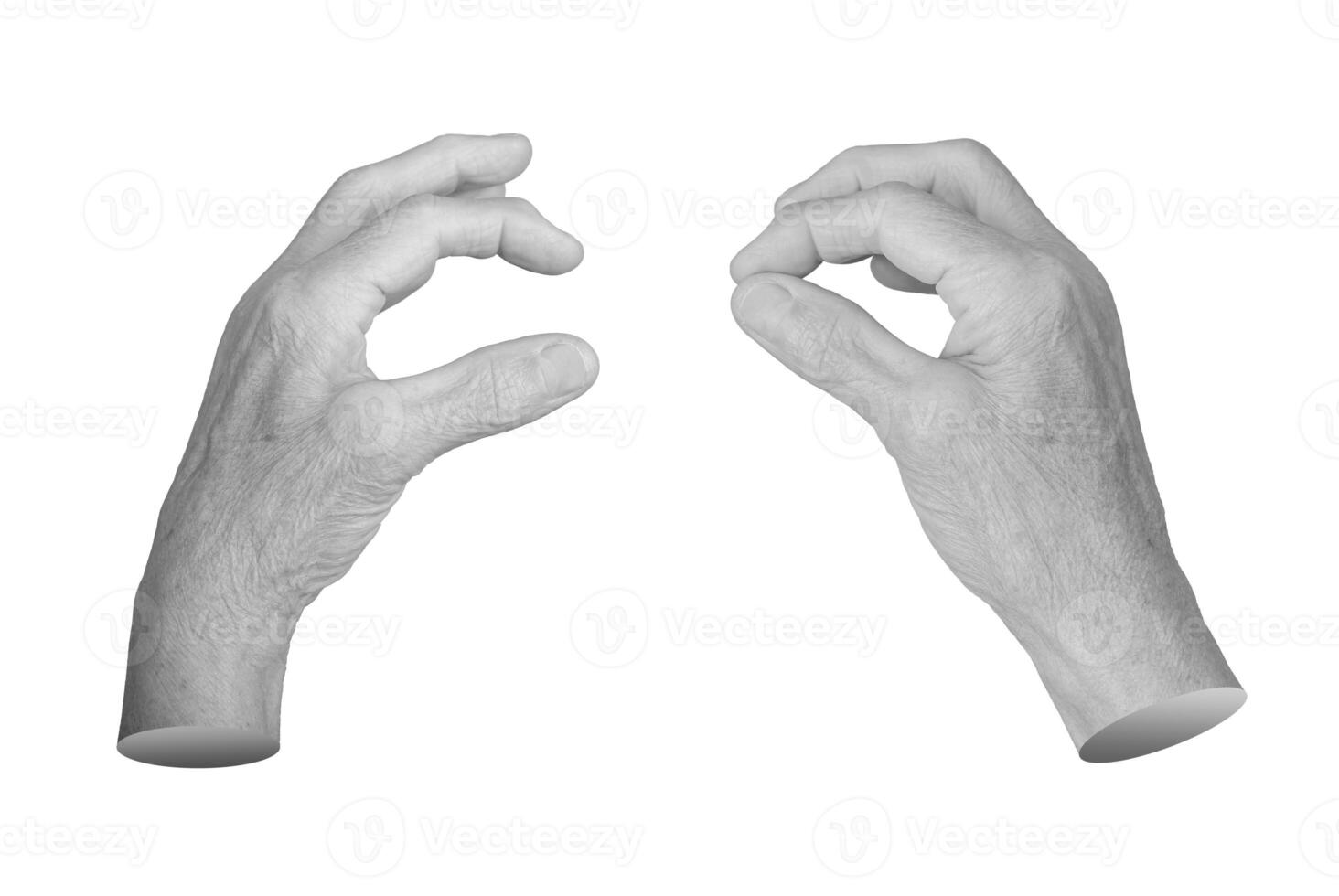Elderly female hand in a pinching gesture, fingers delicately holding something tiny or invisible. photo