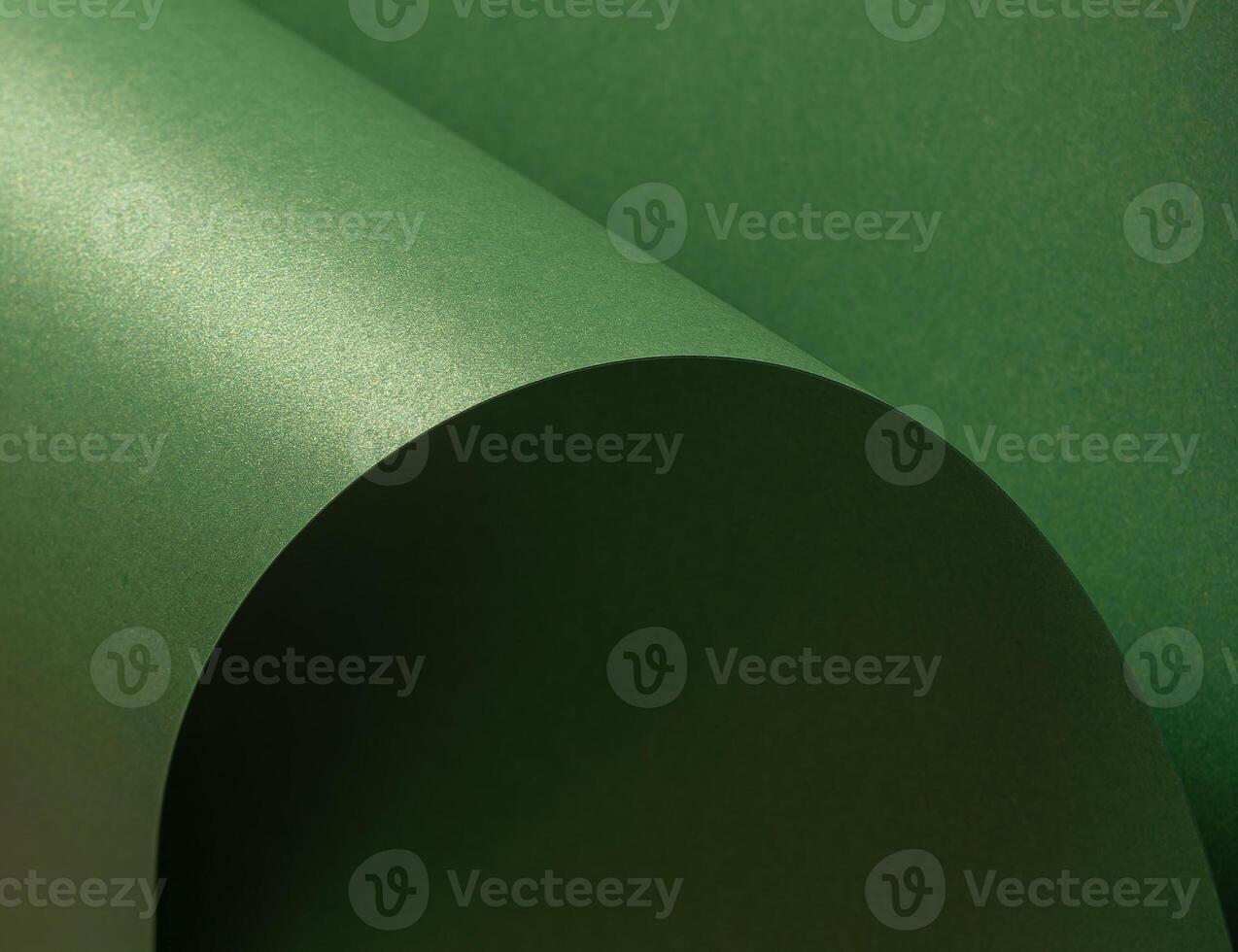 Deep green paper background with a smooth matte texture and subtle wavy edges. Earthy olive and photo