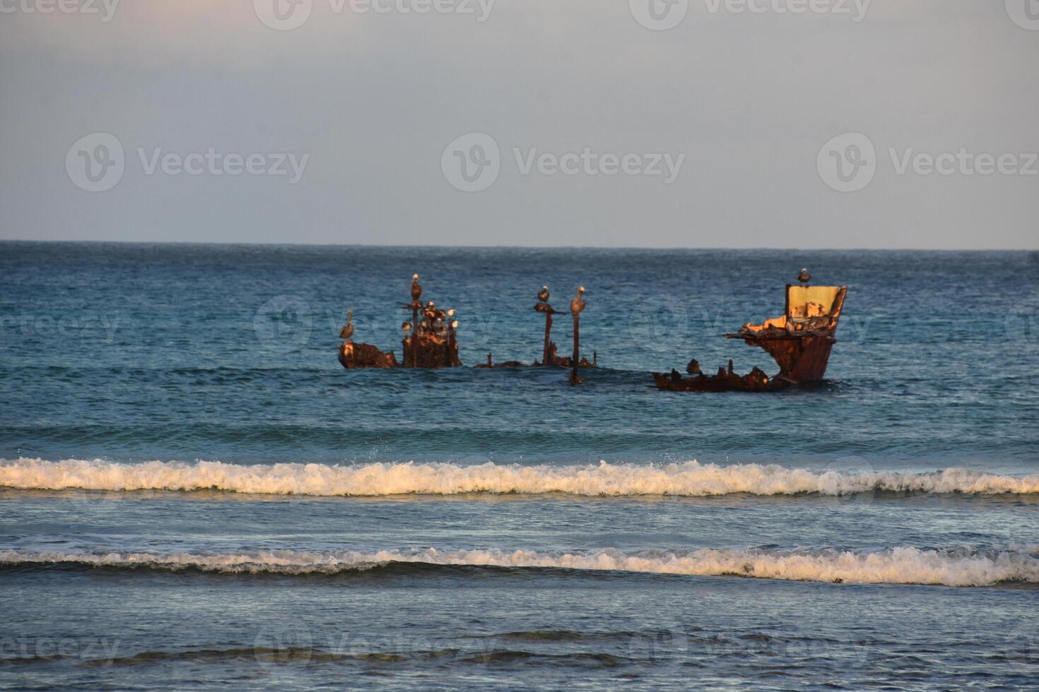 Sun Rising Over the Remains of a Shipwreck photo