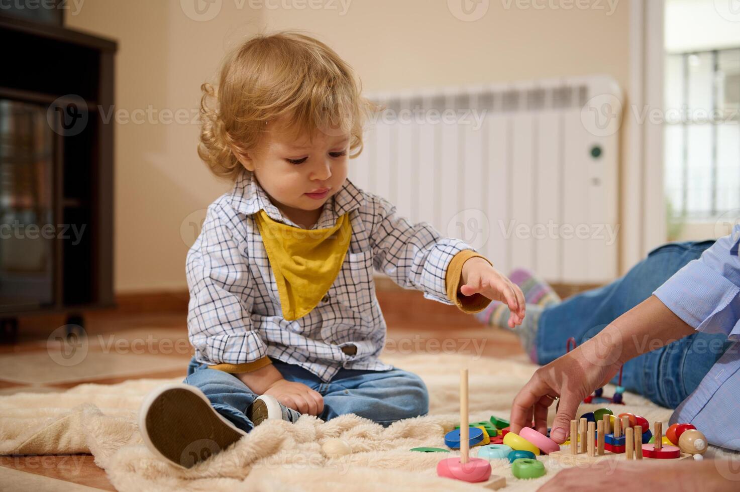 Playful Toddler Engaged in Colorful Educational Activities Indoors photo