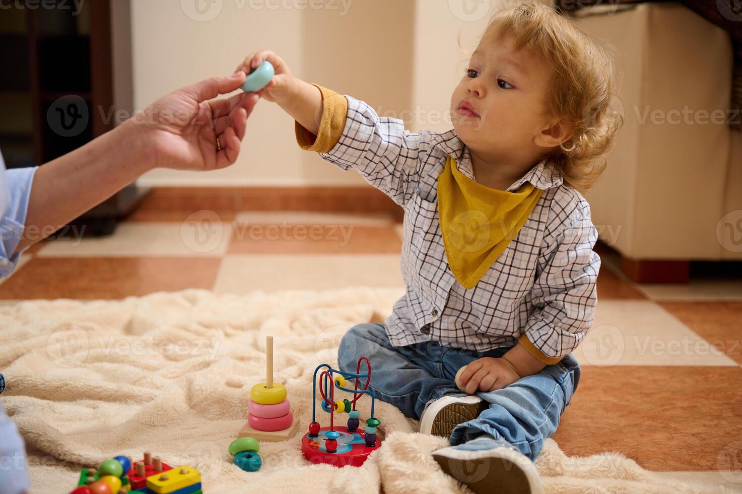 Young Toddler Playing Indoors with Educational Toys During Quality Maternity Leave photo