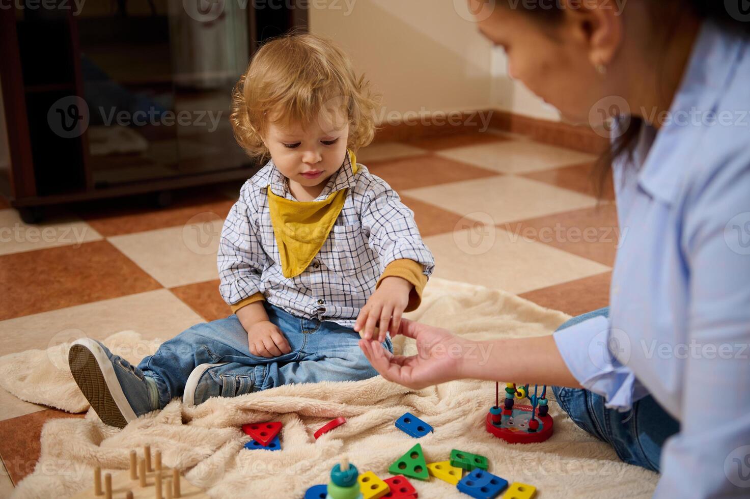 Young Child Playing and Bonding with Mother Through Creative Toy Activities photo