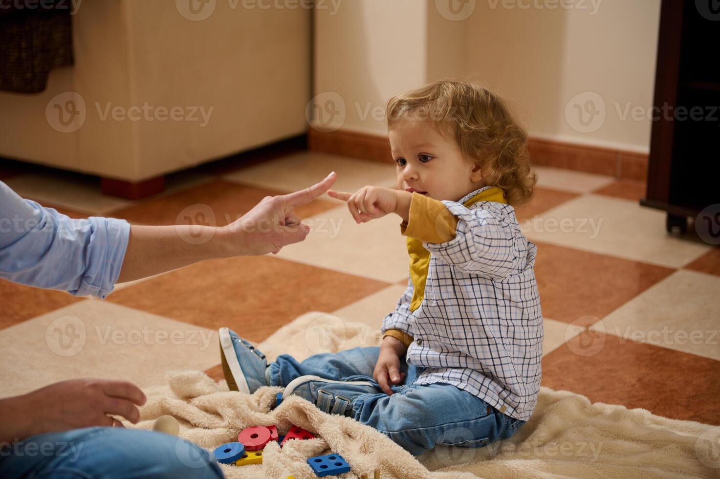 Mother and Child Joyfully Bonding During Playtime on a Cozy Indoor Afternoon photo