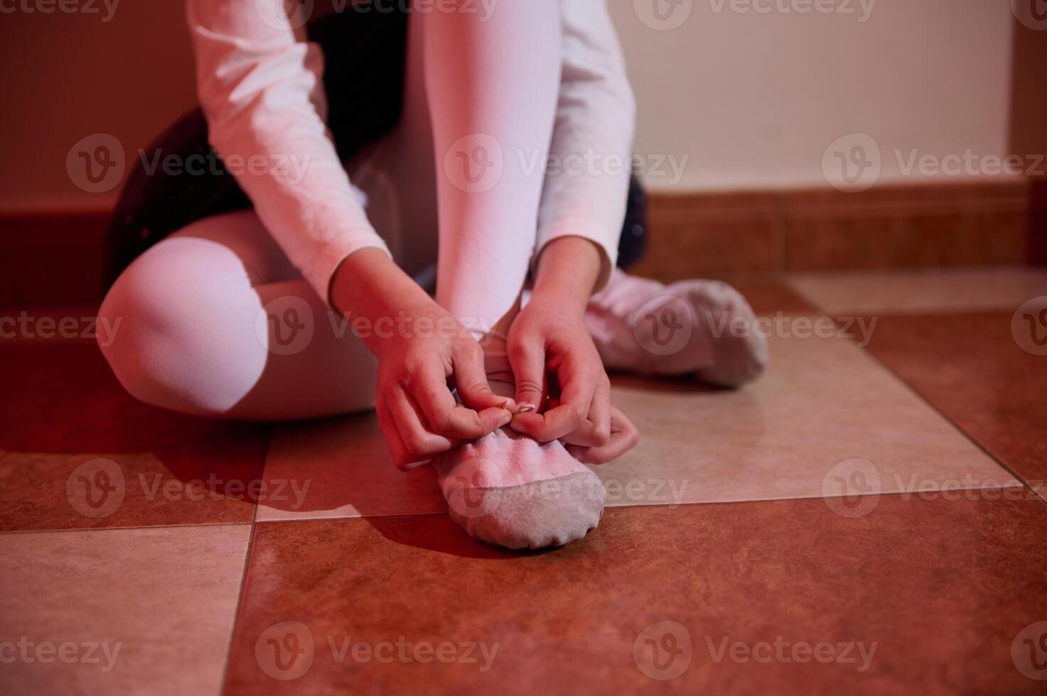 Child Prepares for Dance Practice in Brightly Lit Room photo