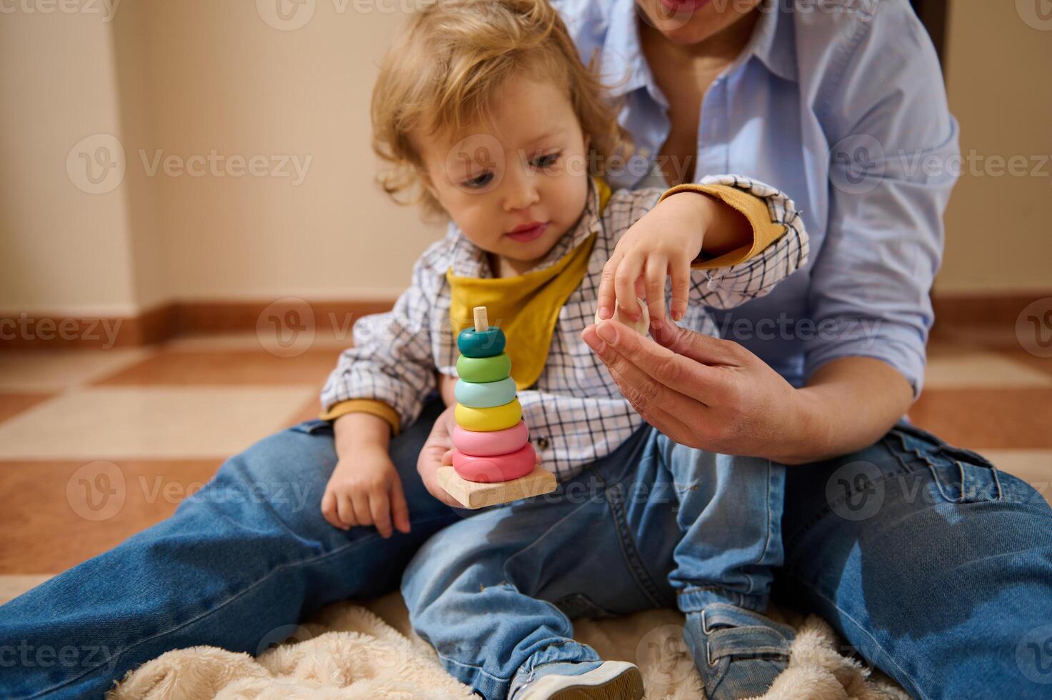 Mother and Toddler Enjoy Fun Learning Time with Stacking Toys Indoors photo