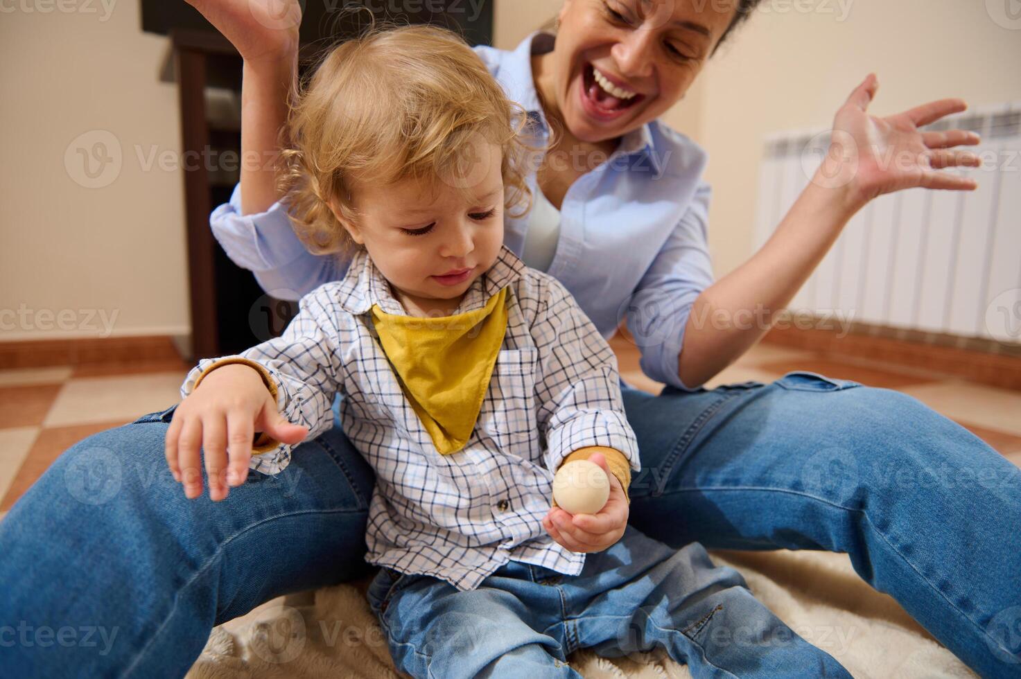 Happy Mother Playing With Her Curious Child During Quality Time Indoors photo