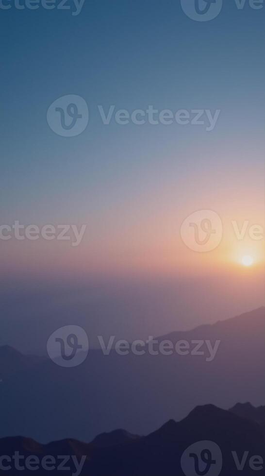 Stunning Scenic Phone Wallpaper of a Mountainous Landscape at Sunset photo