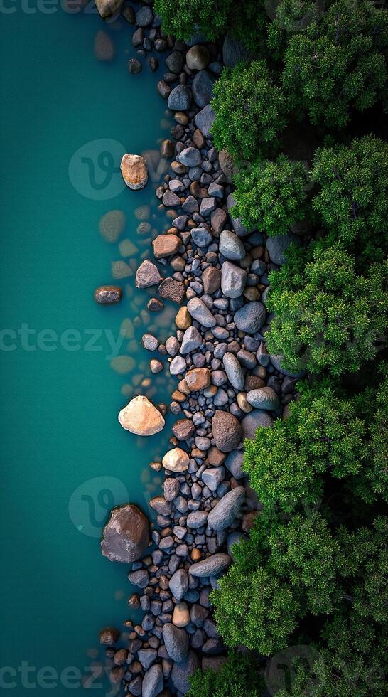 Beautiful Phone Wallpaper Featuring Serene Waters and Rocky Shoreline Overview photo