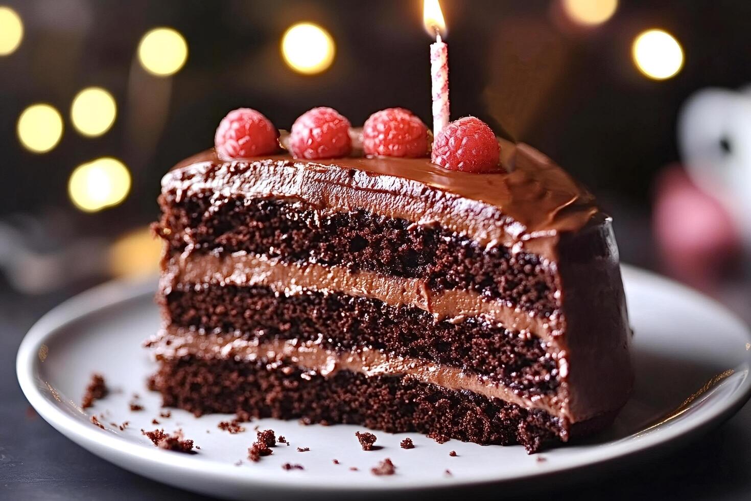 Delicious chocolate cake slice with raspberry topping photo