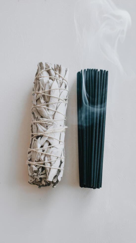 White sage and incense on a white background photo
